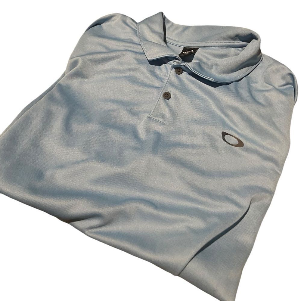 Oakley size XL gold shirt great condition